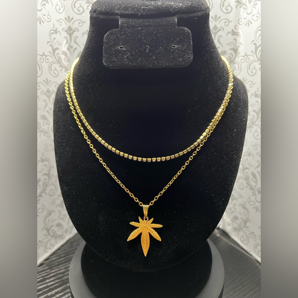 16” Necklace with weed pendant and chain extender. Handmade by Mua.